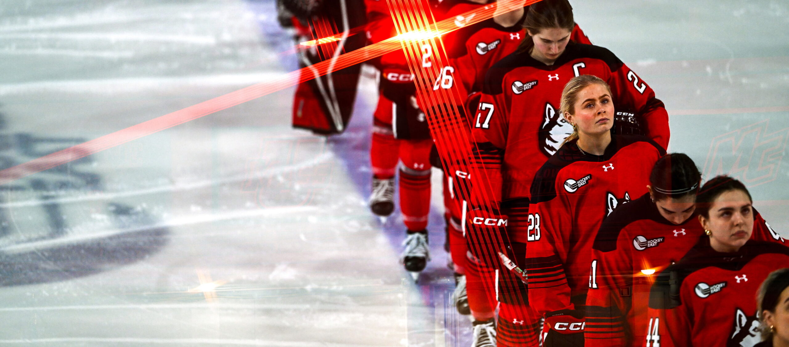 northeastern ice hockey womens team lining up for the national anthem