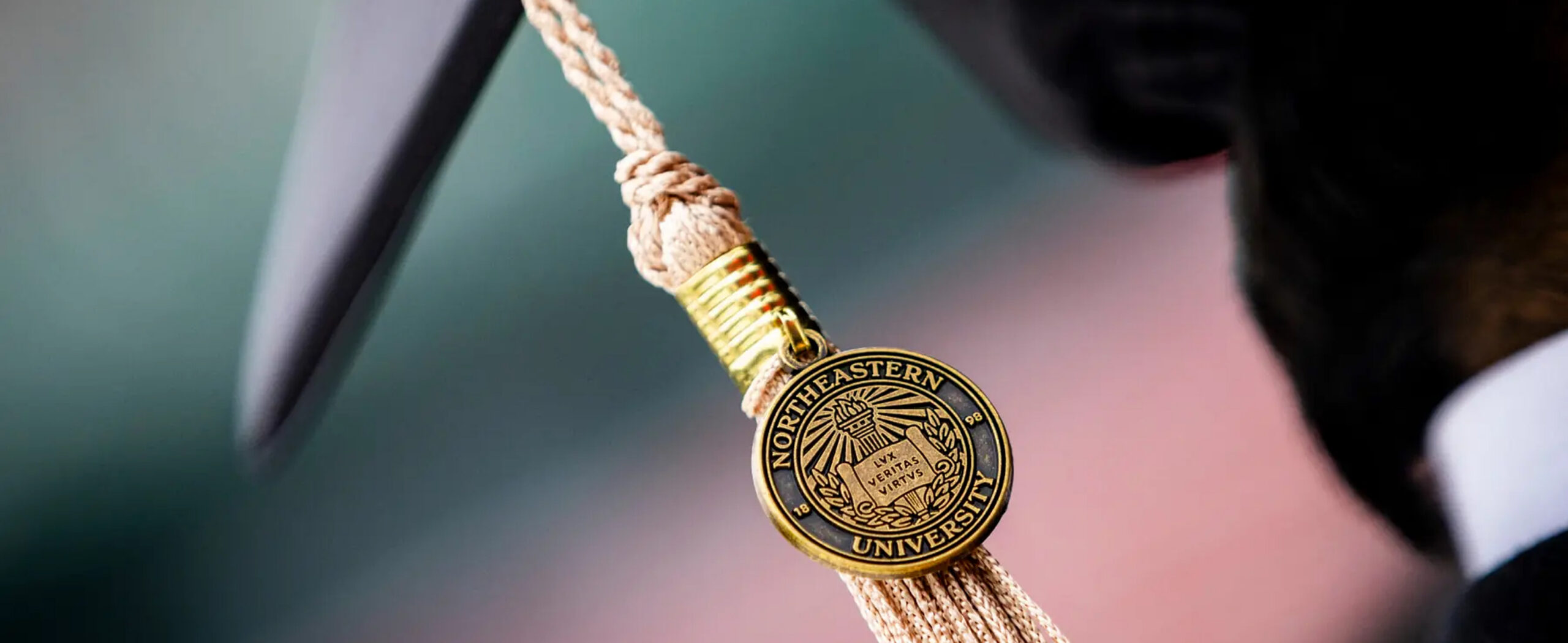 Northeastern graduation cap tassle with the university seal on it
