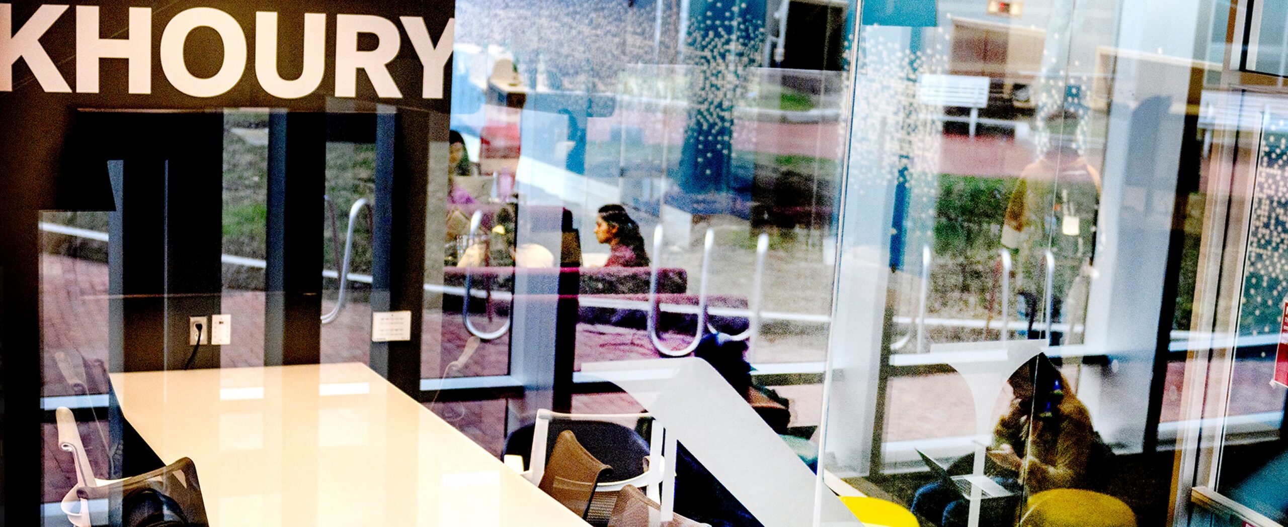 student inside Northeasterns khoury school studying 
